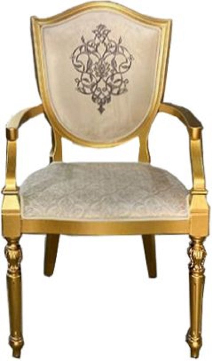 Casa Padrino Art Deco Esszimmerstuhl Cremefarben / Gold - Massivholz Stuhl mit Armlehnen und elegantem Muster - Art Deco Esszimmer Möbel